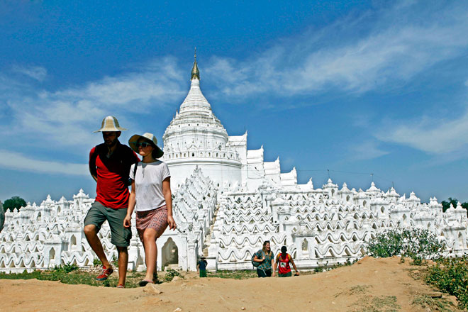 Tourists visit the Mya Thein Tan pagoda in Sagaing, some 10 kilometres northwest of Mandalay, Myanmar, February 6, 2015. Photo: Pyae Sone Aung/EPA