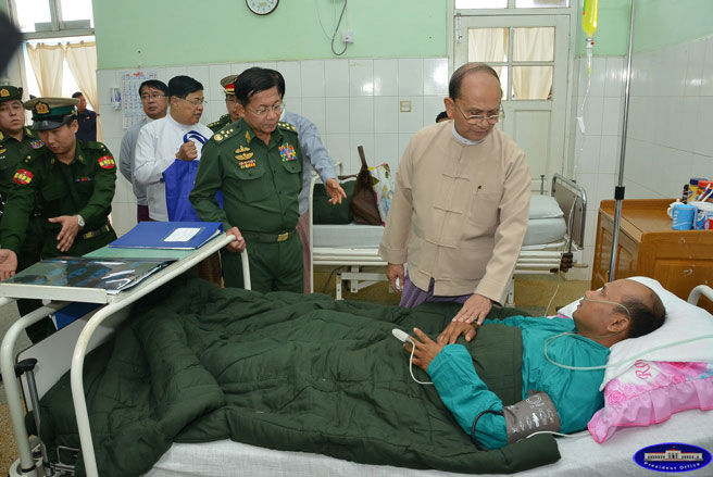 President U Thein Sein visits injured military personnel and families of soldiers killed during clashes with Kokang fighters in Laukkai area, Shan State, on February 16, 2015. Photo: President's Office