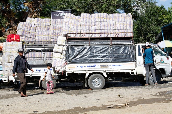 Trucks loaded with goods stop on the Indian-Myanmar border road in the border town of Tamu, Myanmar on November 29, 2014. Photo: Hong Sar/Mizzima