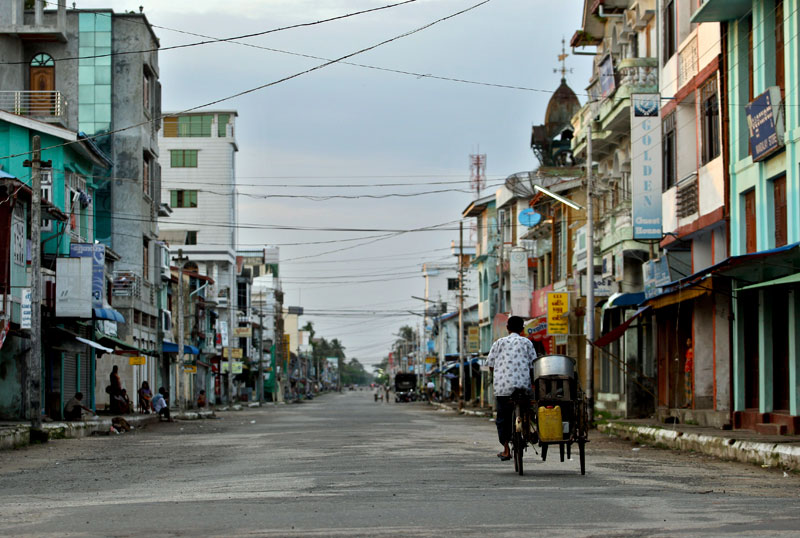 Rakhine State is the home to most of Myanmar's white card holders. A trishaw drives along the main road during the curfew time following communal violence in Sittwe, Rakhine State, Myanmar, June 17, 2012. Photo: Lynn Bo Bo/EPA