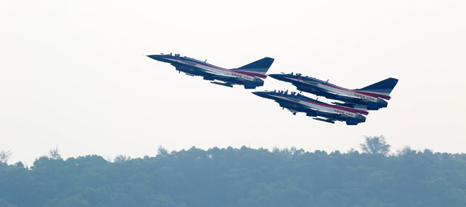 Tensions have heightened on the Myanmar-China border following the death of four Chinese civilians by Myanmar bombing or shelling. Three J-10 fighter jets on the August 1st Aerobatics Team of the People's Liberation Army Air Force perform in the sky during the China International Aviation Aerospace Exhibition in Zhuhai, in south China's Guangdong province, November 11, 2014. Photo: Joy My/EPA