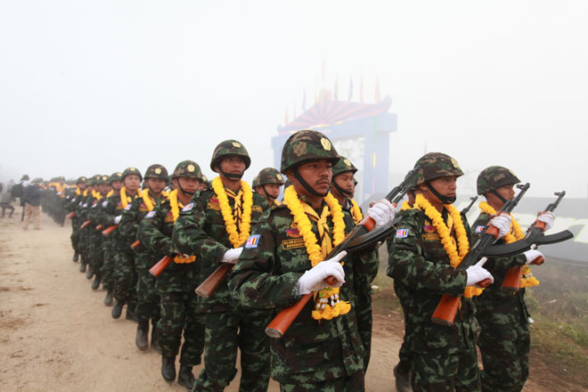 Democratic Karen Benevolent Army soldiers marching during 19th anniversary of DKBA day held on the Thai-Myanmar border in Kayin State on December 21, 2013. Photo: Hong Sar/Mizzima