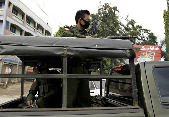 Armed Myanmar Border Guard Forces patrol in the streets of Myawaddy, Kayin State, Myanmar, October 2, 2014. Photo: Lynn Bo Bo/EPA