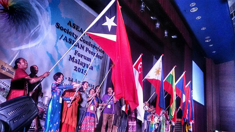 Representatives of the 10 countries of ASEAN plus Timor Leste proudly waving their flags in solidarity at the ASEAN People's Forum in Kuala Lumpur, April 22, 2015. Photo: ASEAN Peoples' Forum