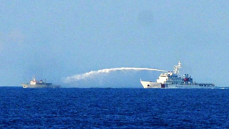 A Chinese Coast Guard vessel (right) using water cannon against a Vietnamese fisheries surveillance ship in disputed waters of the South China Sea off Vietnam’s central coast, in a file photo taken on June 2, 2014. Reports of an encounter between the two countries in the South China Sea in June 2011 were censored by the Myanmar authorities in China’s favour. Photo: AFP/Vietnam News Agency