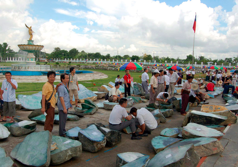 Gem merchants examine jade lots at a special sale of jade in Yangon. Archive photo: EPA