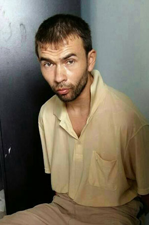 A Thai Royal Police handout photo taken with a mobile phone showing Turkish suspect, Adem Karadag, in Bangkok, Thailand on 29 August 2015 who is being held for being allegedly involved with the bomb attack, at the Hindu Erawan Shrine on 17 August 2015. Photo: Thai Royal Police/EPA