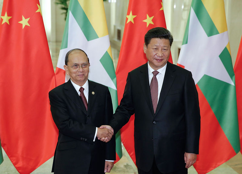 Chinese President Xi Jinping (R) shakes hands with Myanmar's President Thein Sein (L) at The Great Hall Of The People in Beijing, China, 04 September 2015. Photo: Lintao Zhang/EPA