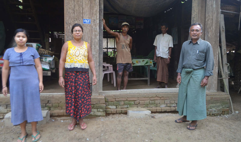 A family of Kamans including Than Win, the MP candidate running for a seat in the Rakhine State parliament seen in front of their home in Thandwe. Photo: Swe Win/Myanmar Now