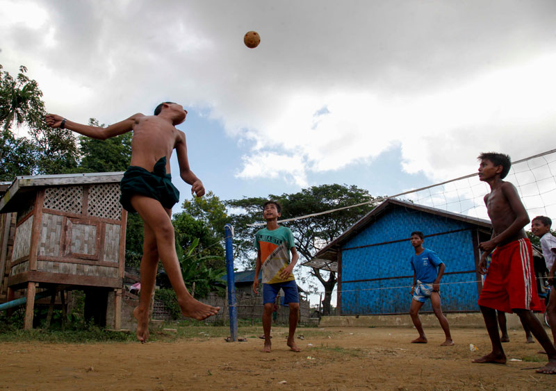 Rohingya Muslim boys play sepak takraw at Thekkelpyin Internally Displaced Parsons (IDPs) camp near Sittwe of Rakhine State. Photo: Nyunt Win/EPA