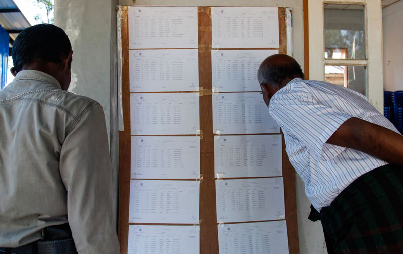 Rohingya, Muslim men check their names on final voter list displayed at Dar Baing Internally Displaced Parsons (IDPs) camp near Sittwe of Rakhine State, western Myanmar, 03 November 2015. Photo: Nyunt Win/EPA