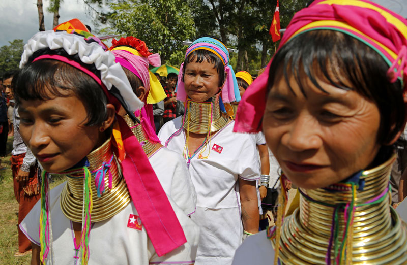 Padaung ethnic women arrive to listen to a speech byMyanmar opposition leader Aung San Suu Kyi during her first official election campaign at Demoso township Kayah State, eastern Myanmar, 10 September 2015. Photo: Lynn Bo Bo/EPA