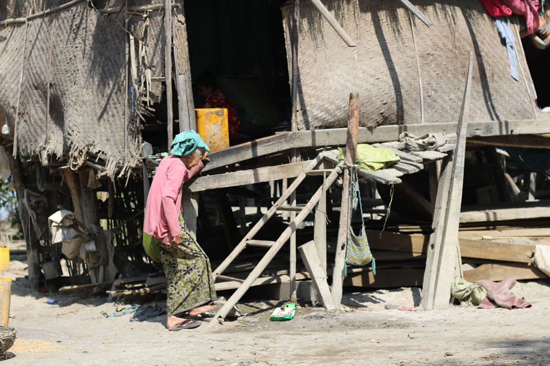 Pwint Phyu Township (2) - A local woman in front of her flood-damaged home in Sipintharyar village (Credit:- Ei Cherry Aung/Myanmar Now)