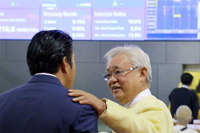 U Theim Wai aka Serge Pun, FMI's Executive Chairman, right, during the opening ceremony of the Yangon Stock Exchange (YSX) in March. Photo: Mizzima