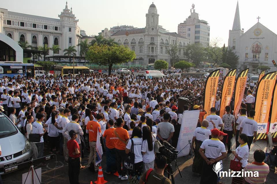 A crowd gathers at Maha Bandoola Park in central Yangon on 4 April 2017 to hear about the new "Start With Me" Road safety campaign.