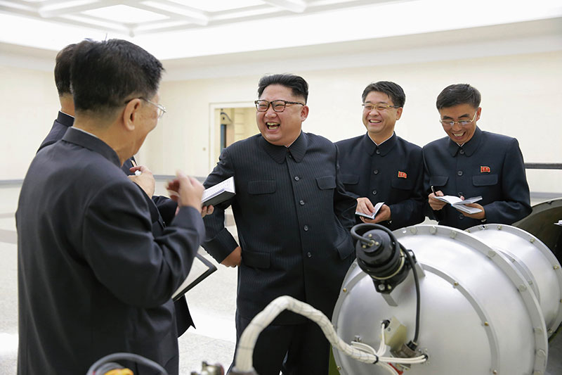 North Korean Central News Agency (KCNA), the state news agency of North Korea, on 3 September 2017 shows Kim Jong-un (3-R), chairman of the Workers' Party of Korea, chairman of the State Affairs Commission of the Democratic People's Republic of Korea (DPRK) and supreme commander of the Korean People's Army (KPA), purportedly guiding the work for nuclear weaponization on spot, at an undisclosed location, North Korea.