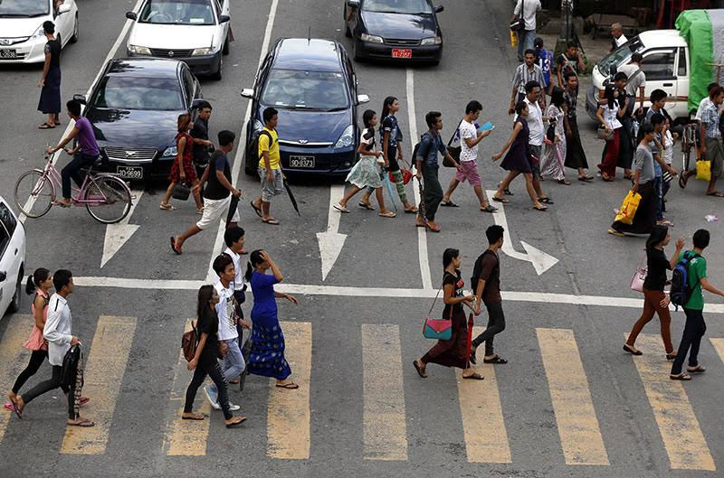 Prospects look good for Myanmar - People crossing a busy road in downtown Yangon. Photo: Nyein Chan Naing/EPA