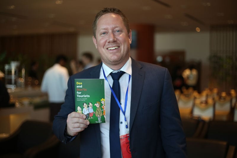 Mr. Achim Munz Resident Representative at Hanns Seidel Foundation holding the Tourist guide.