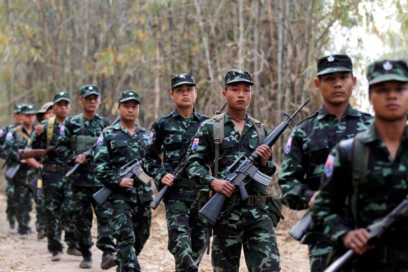 (File) Karen National Union (KNU) guerillas with their weapons parade. Photo: Rungroj Yongrit/EPA