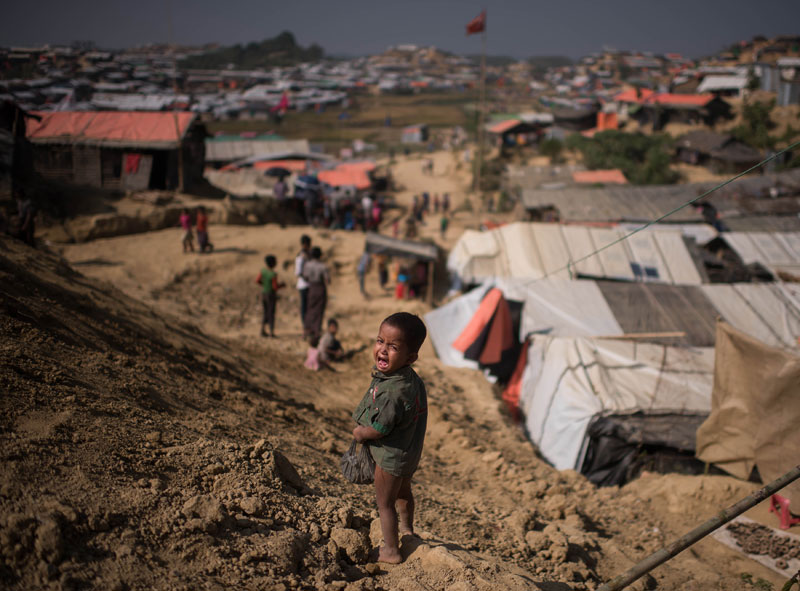 (FILES) In this file photo taken on November 29, 2017 a Rohingya Muslim refugee child cries as he stands near the Thyangkhali refugee camp at Cox's Bazar. Photo: Ed Jones/AFP