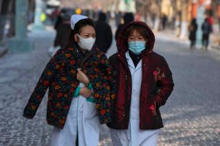 Medical staff walk on the street in Harbin, Heilongjiang province, China, 15 January 2021. Photo: EPA