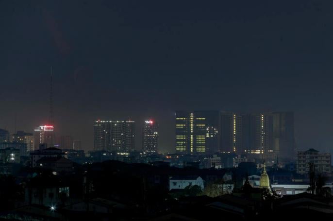 The high-rise buildings lie under misty sky at early morning in Yangon, Myanmar. Photo: Lynn Bo Bo/EPA