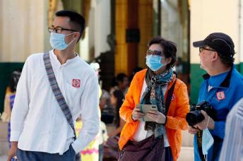 Tourists wear masks as they visit the Shwedagon pagoda in Yangon, Myanmar. Photo: Nyein Chan Naing/EPA
