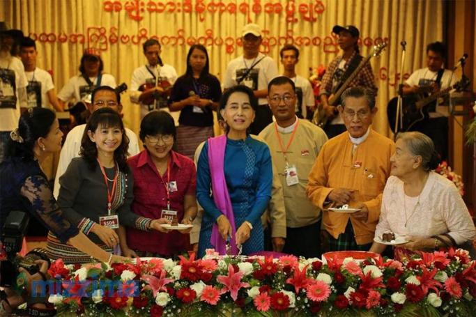 Myanmar opposition leader Aung San Suu Kyi cuts her birthday cake during a ceremony in celebration of her 70th birthday at the Royal Garden restaurant in Yangon on 21 June 2015. Photo: Thet Ko/Mizzima