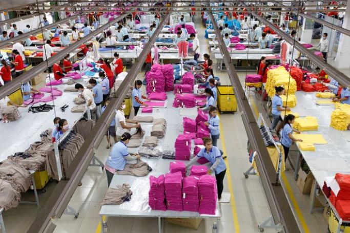 Cambodian workers in a garment factory in Phnom Penh, Cambodia, June 15, 2013. Photo: Mak Remissa/EPA