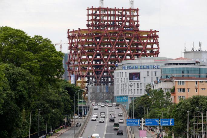 Cars pass on the Hledan flyover in Yangon, Myanmar. Photo: Nyein Chan Naing/EPA