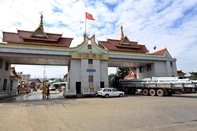 A loaded truck with industrial goods passes from China to Myanmar at the Kyegaung border gate, in Ruili, Yunnan province, China. Photo: Nyein Chan Naing/EPA