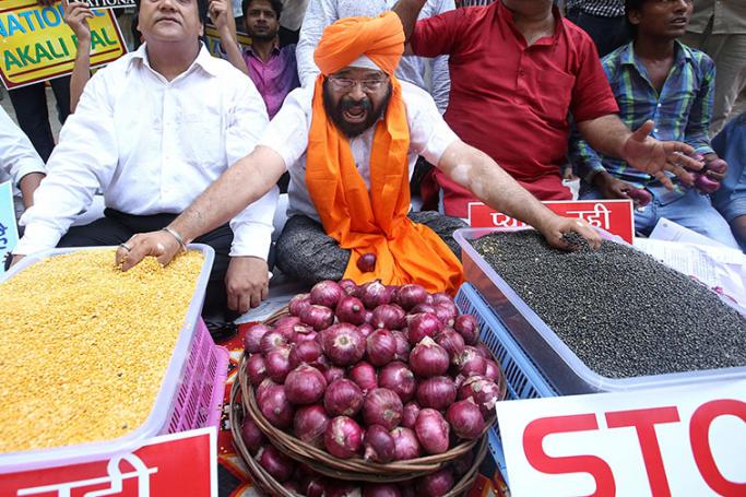 File photo - Protest over rising food prices in New Delhi, India in 2015. Photo: EPA