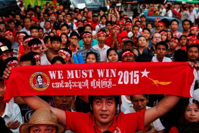 Supporters of National League for Democracy (NLD) party celebrate in front of the NLD headquarters a day after general elections in Yangon, Myanmar, 09 November 2015. Photo: Lynn Bo Bo/Mizzima