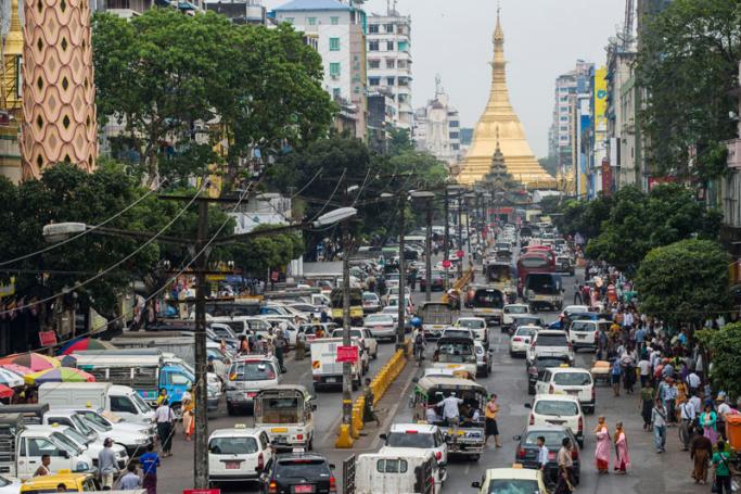 Traffic is seen on Mahabandoola road, with the Sule pagoda in the background, in central Yangon. Photo: Romeo Gacad/AFP