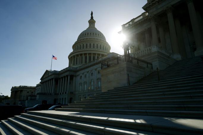 The sun sets on the US Capitol building, Washington DC, United States. Photo: Michael Reynolds/EPA