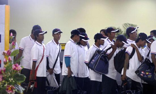 Myanmar fishing industry workers alleged to have been working under slave labor conditions arrive back to Myanmar from Indonesia, at Yangon International airport, Yangon, Myanmar, 14 May 2015. Photo: Nyein Chan Naing/EPA