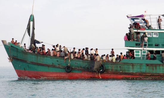Refugees from Myanmar and Bangladesh are seen in their boat before their rescue by Aceh fisherman in Julok, East Aceh, Sumatra, Indonesia, 20 May 2015. Photo: EPA