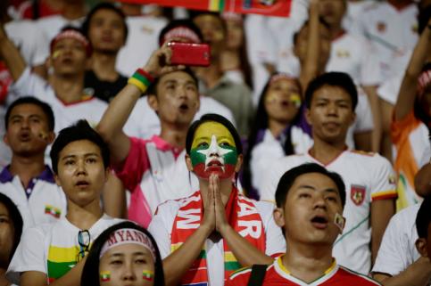 A Myanmar soccer fan prays before the start of the soccer match against the Philippines at the Jalan Besar Stadium in Singapore, 07 June 2015. EPA/WALLACE WOON