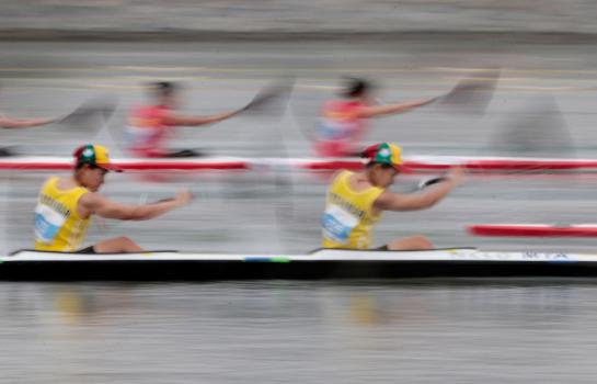 A slow shutter image of the women's K4 canoeing teams from Myanmar (front) and Vietnam (back) during the women's K4 200m canoeing race at the 28th SEA Games 2015 in Singapore, 09 June 2015. Thailand won the men's and women's K4 200m Canoeing events. EPA