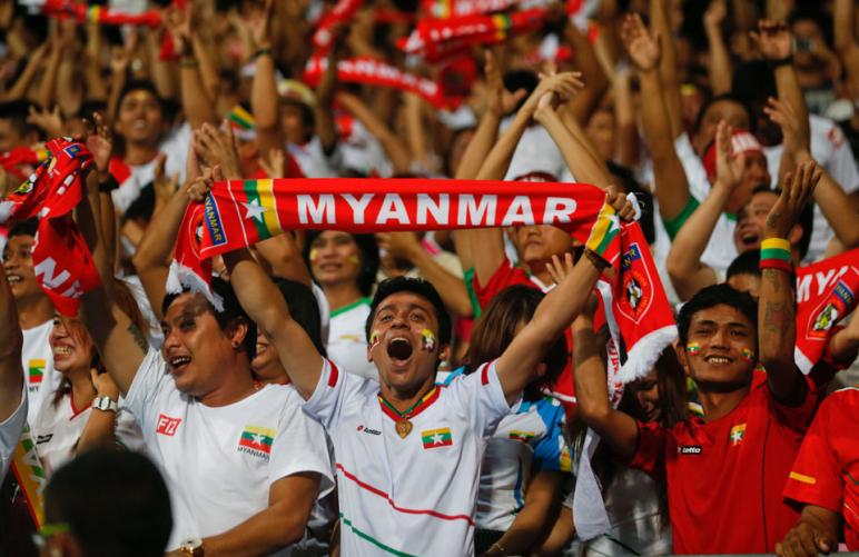 Myanmar fans cheer their team during the first round Group B soccer match between the Philippines and Myanmar for the South East Asian Games 2015 at the Jalan Besar Stadium in Singapore, 07 June 2015. Myanmar won with the result 5-1. EPA/LYNN BO BO