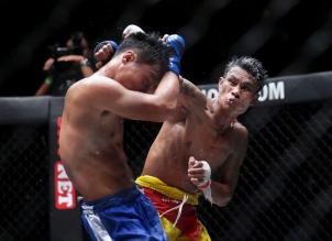 Myanmar traditional boxers Soe Htet Oo (R) and Phyan Tway (L) in action during their Mixed Martial Arts (MMA) One Championship fight in Yangon, Myanmar, 18 July 2015.