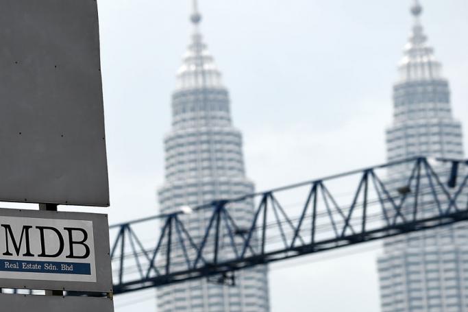 The 1 Malaysia Development Berhad (1MDB) logo is seen on a billboard at the funds flagship Tun Razak Exchange under-development site in Kuala Lumpur. Photo: AFP