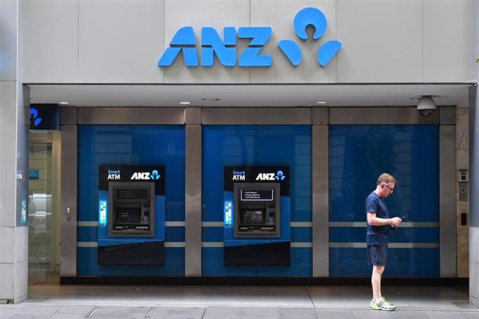 A man stands near Australia and New Zealand Banking Group Limited (ANZ) automatic teller machines (ATMs) in Sydney, New South Wales, Australia, 16 December 2019. Photo: EPA