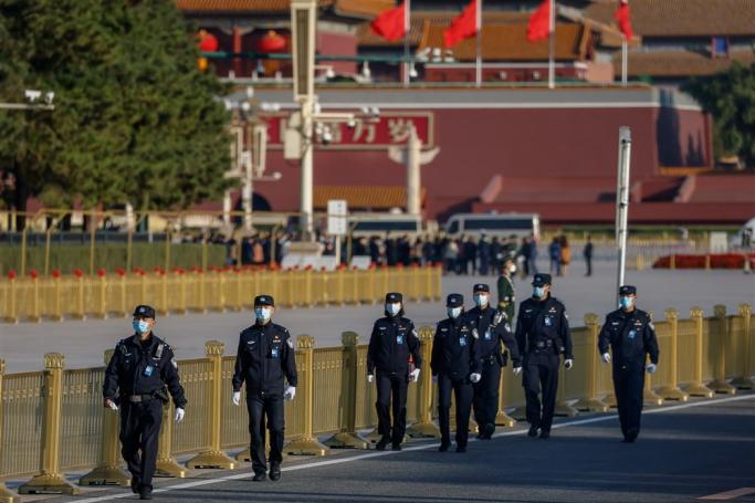 Police patrol along Tiananmen Square ahead of the opening ceremony of the 20th National Congress of the Communist Party of China at the Great Hall of People in Beijing, China, 16 October 2022. Photo: EPA