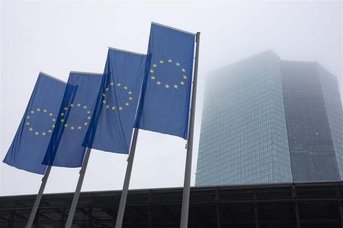 EU flags outside the European Central Bank (ECB) office building complex in Frankfurt am Main, Germany, 15 December 2022. Photo: EPA