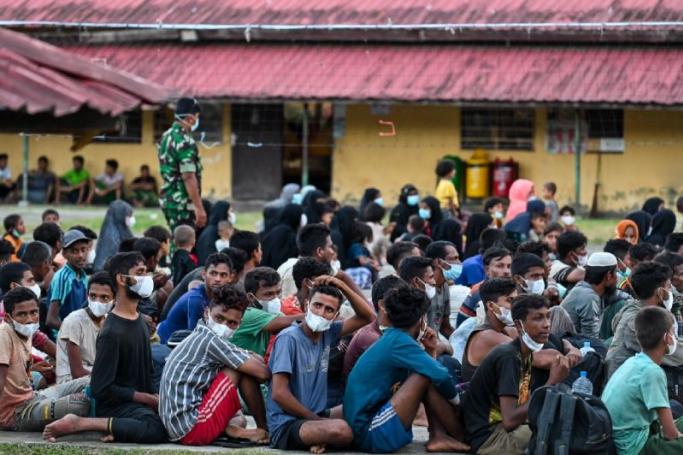 Rohingya refugees gather at a makeshift shelter, upon their arrival in the Padang Tiji district of Indonesia’s Aceh province on November 14 2023. / Photo: AFP