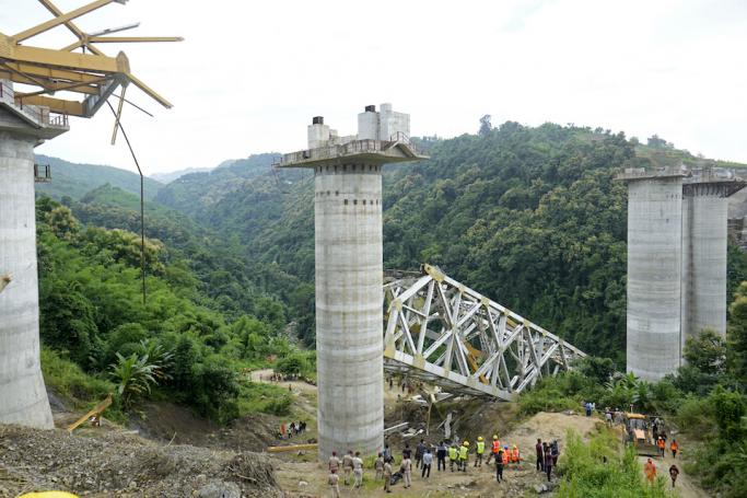 Rescue workers conduct a search operation at the site of an accident where an under-construction railway bridge collapsed in Sairang town of the Aizwal district in India's eastern state of Mizoram on August 23, 2023. Photo: AFP