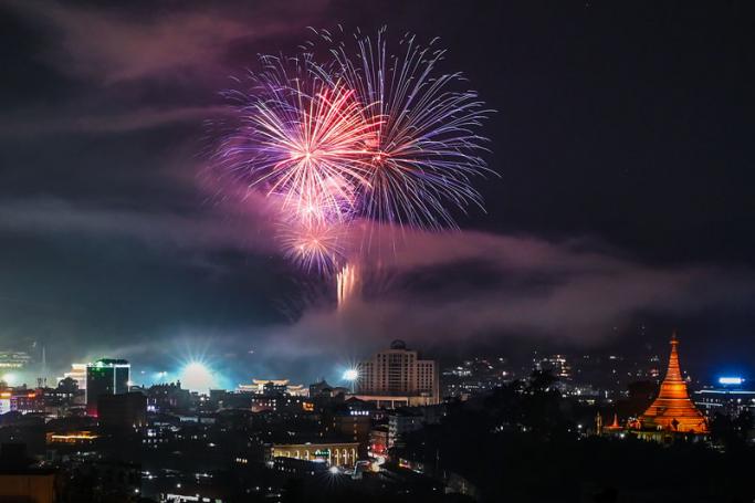 Fireworks explode over the sky after the welcome dinner, organised to commemorate the 30th anniversary of peace-building efforts in Wa State, in Panghsang on April 16, 2019. Photo: Ye Aung Thu/AFP