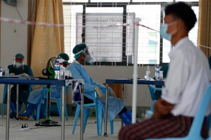 File) A doctor waits for patients inside the Community Fever Clinic which opens, temporarily, at Hlaing Thar Yar town hall in Yangon, Myanmar, 29 April 2020. Photo: EPA