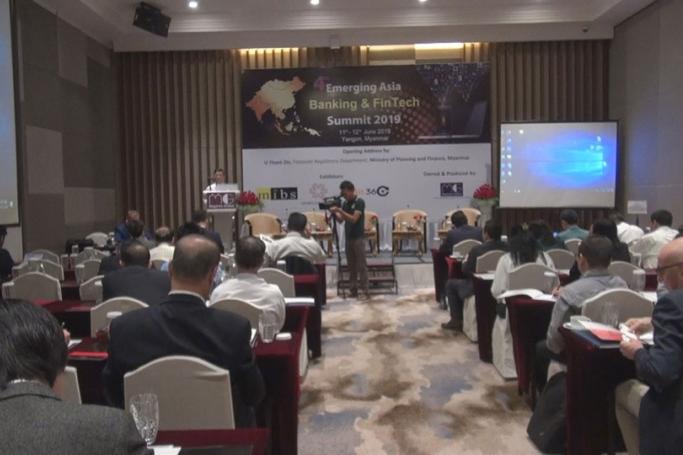 Thant Zin, director at the Financial Regulatory Department, delivers a speech at the 4th Emerging Asia Banking and FinTech Summit 2019 on 11 June. Photo: MITV